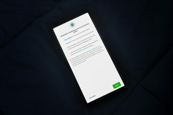 Close-up of smartphone screen showing a privacy policy update agreement