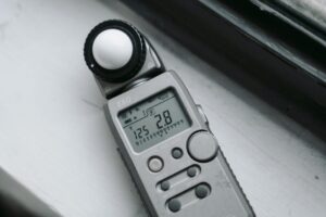 Light meter on a windowsill, used for precise photography light measurements.
