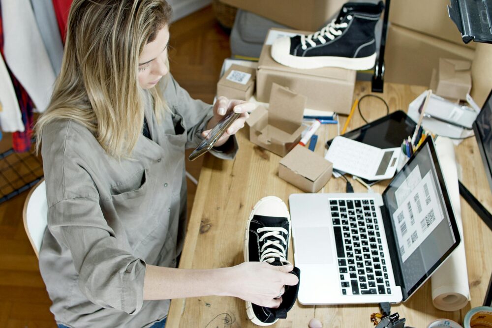 image of a person taking product photos at a desk