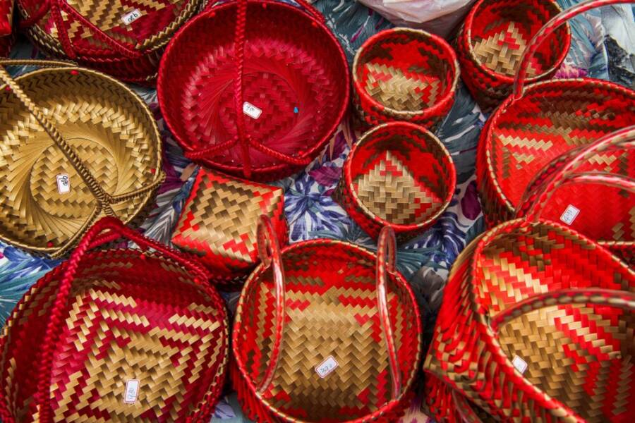 Vibrant handmade woven baskets displayed at a market in Taoyuan, Taiwan.