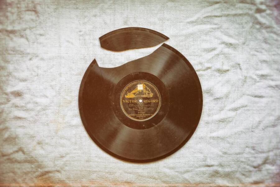 A close-up of a broken vintage vinyl record