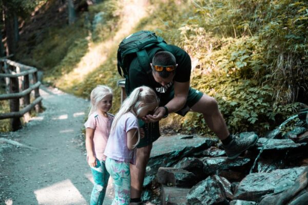 Family exploring nature on a forest path