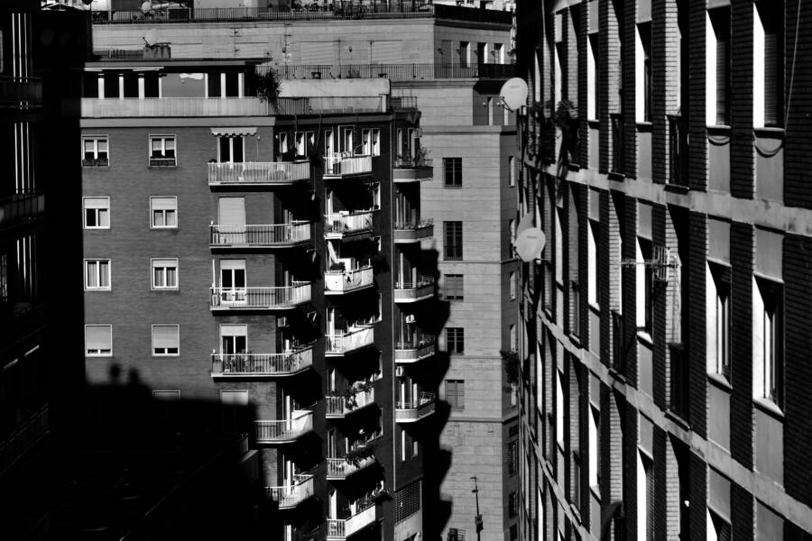 Grayscale photo of apartment buildings in Naples, Italy, highlighting urban design