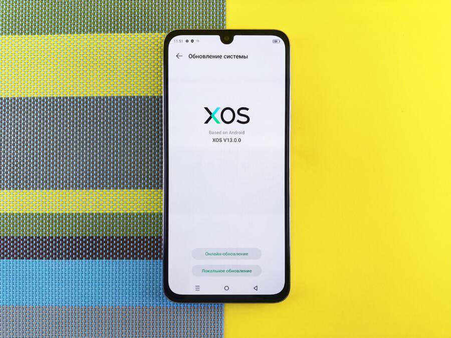 Stop Notification Sound Changes: Fix Unwanted Alert Tones on Your Smartphone Smartphone on colorful background showing XOS version update, based on Android.