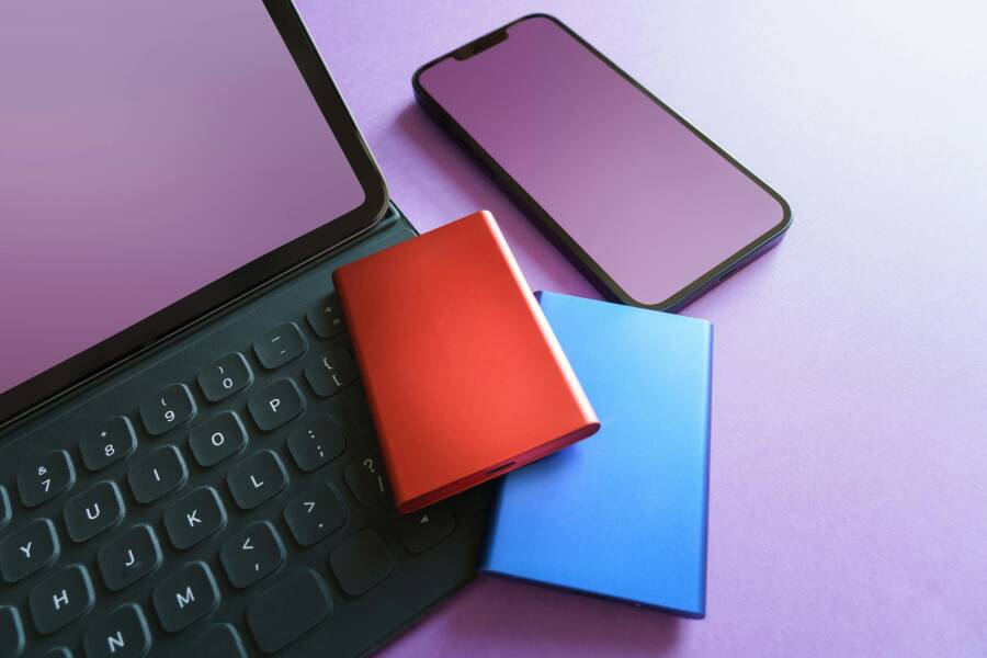 image of a colorful setup with gadgets including a smartphone and SSD