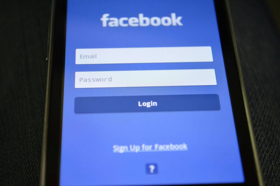 Close-up of a smartphone screen showing the Facebook login interface