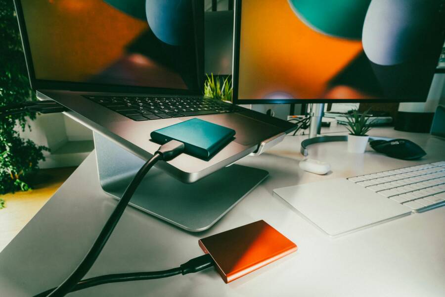 image of a modern home office with devices and backups