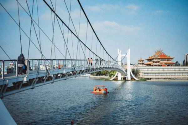 Dramatic view of a suspension bridge and pagoda in Taoyuan City, Taiwan