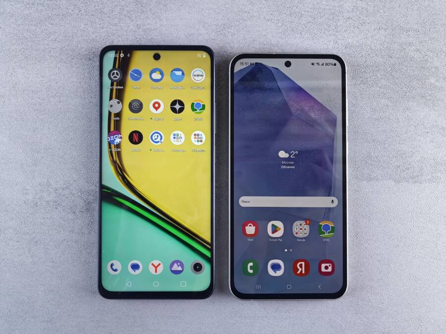 Top-down view of two smartphones with home screens