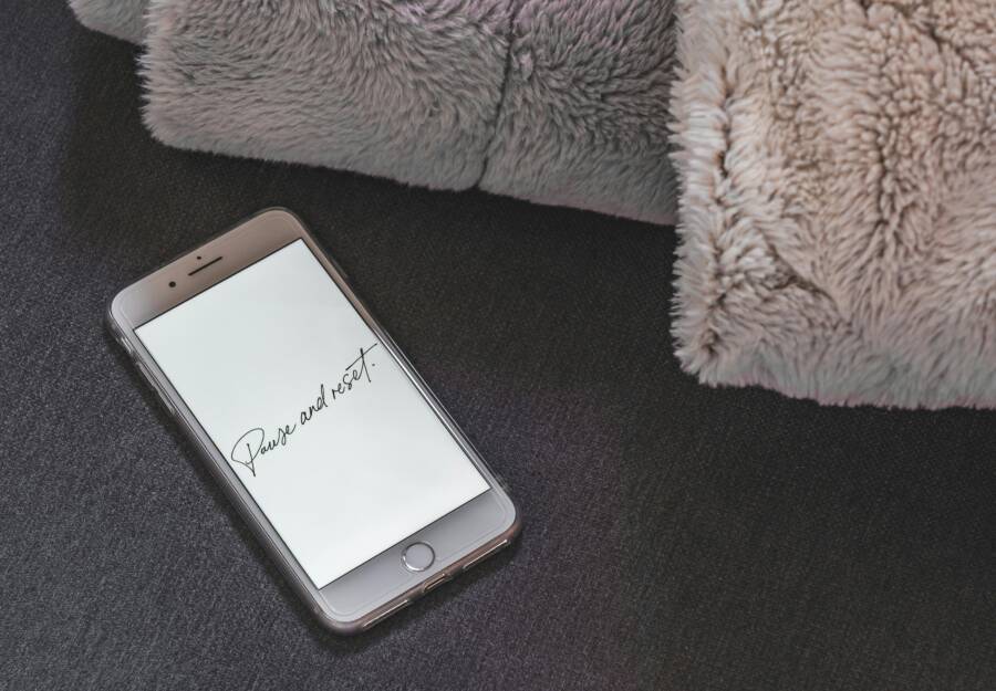 A smartphone on a soft surface showing