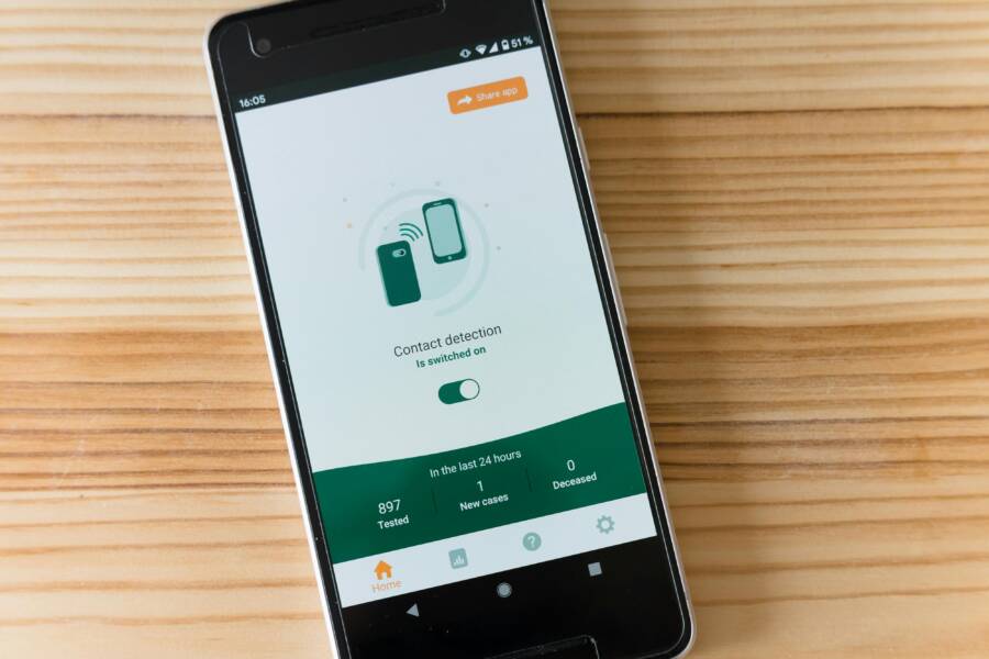 Smartphone with contact management interface on a desk