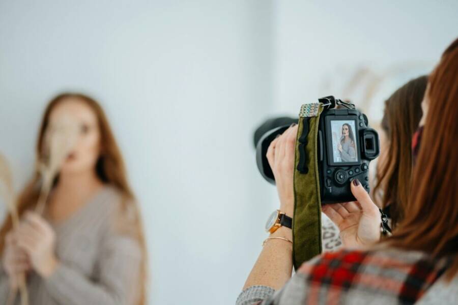 image of a photographer with a camera setup in a studio