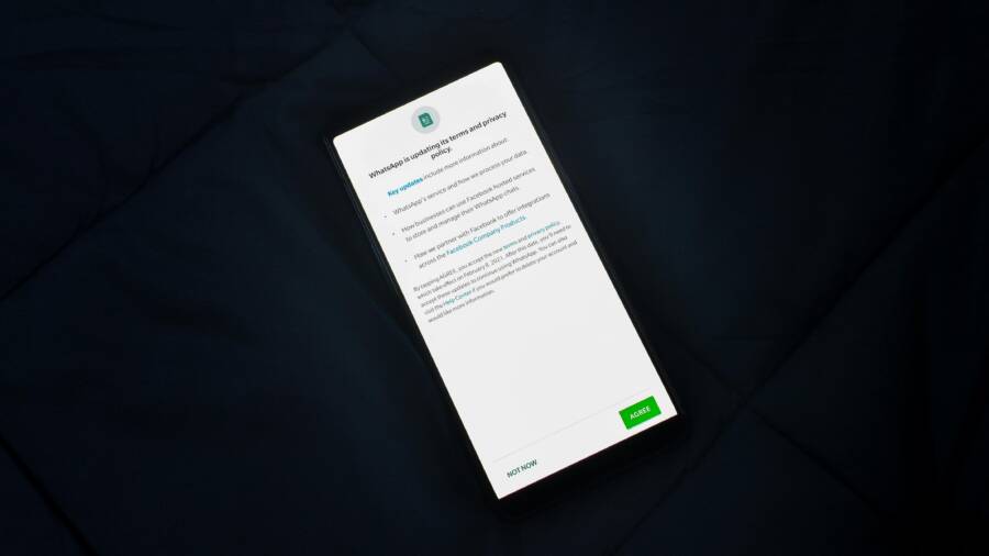Close-up of smartphone screen showing a privacy policy update agreement