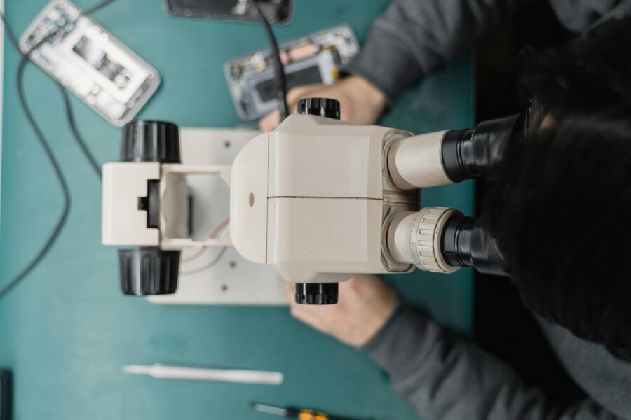 Close-up of a technician working on a phone