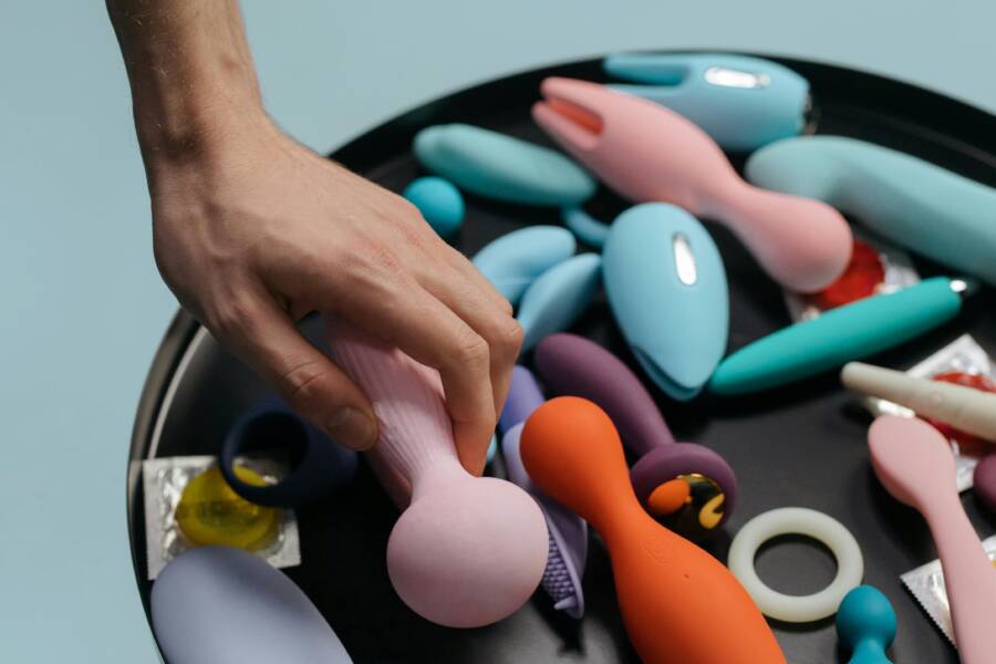 A hand selecting a wellness device on a tray