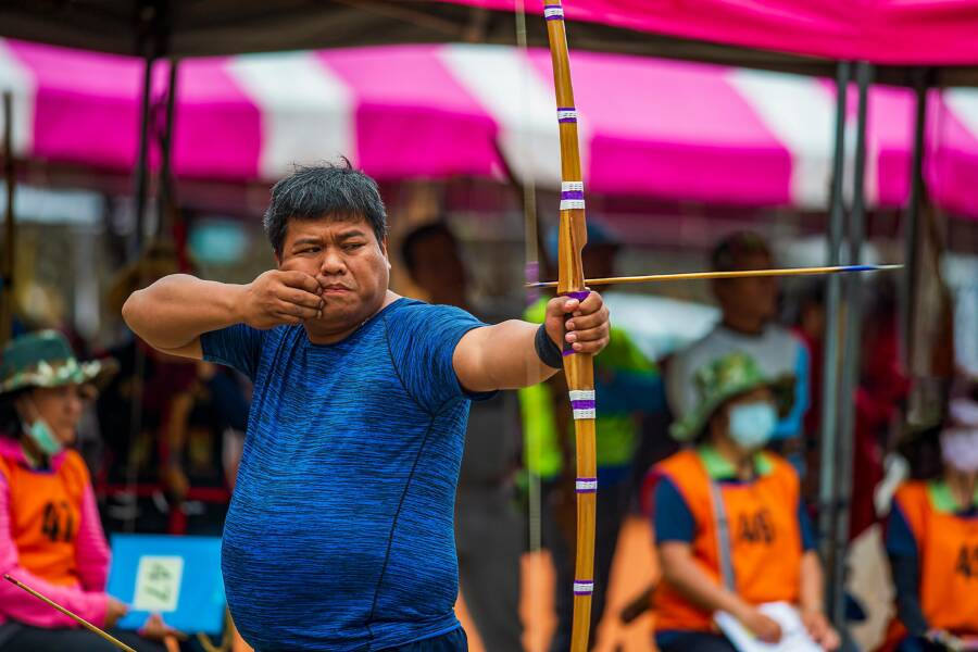 An East Asian man participates in a traditional archery competition in Taitung, Taiwan.