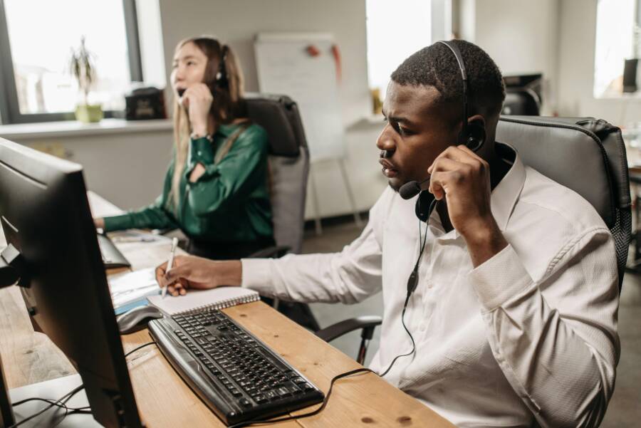 image of a customer service team helping users on phones
