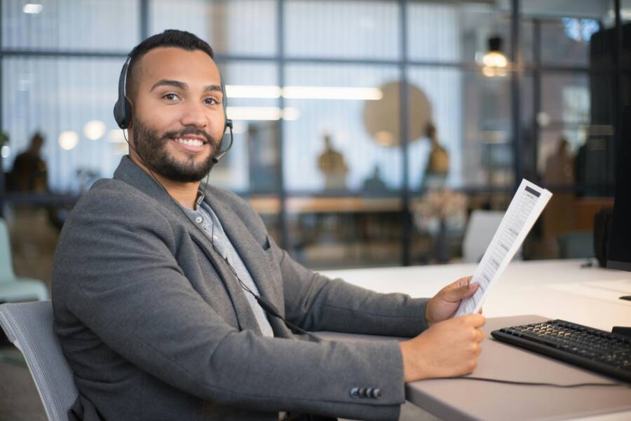 image of a person using a smartphone with a thoughtful look