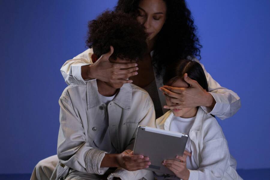 A parent having a calm chat with a child about online safety